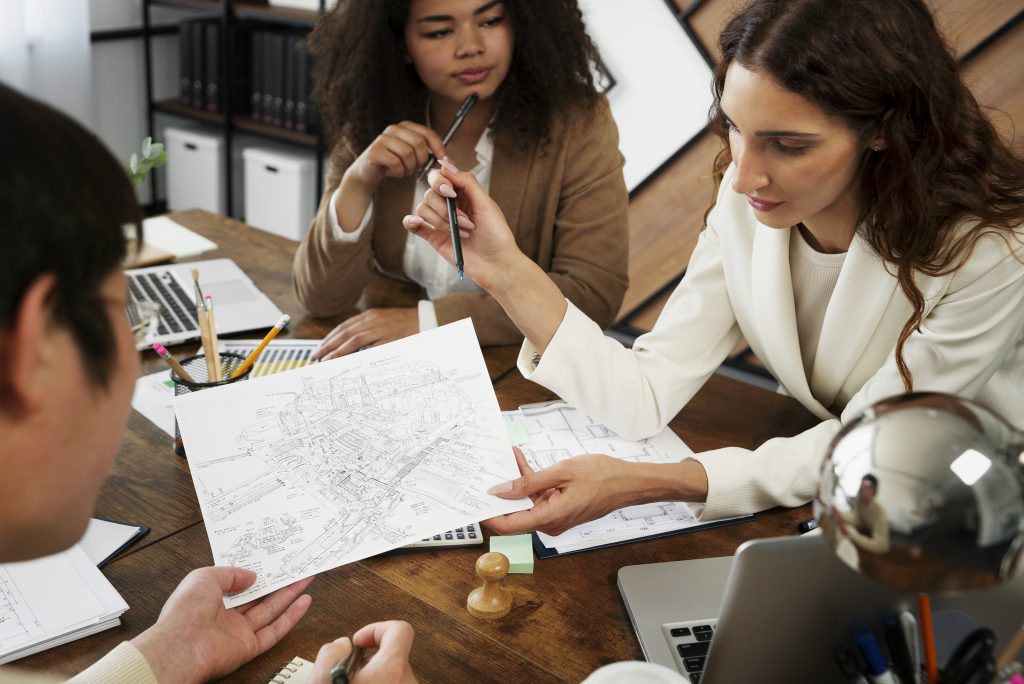 people working elegant cozy office space - Les avantages de travailler avec un cabinet de recrutement spécialisé en fonds d'infrastructure